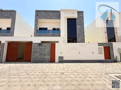 For sale in Al-Amirah, Ajman: a 5-bedroom villa with super deluxe finishing and central air conditioning at a bargain price.