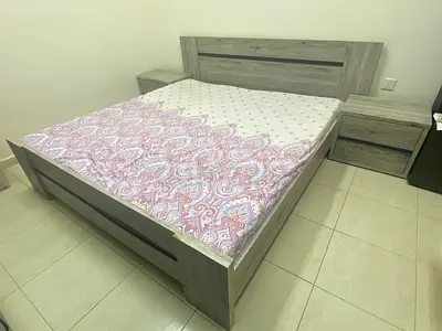 Queen-size wooden bed frame with two matching bedside tables - light oak