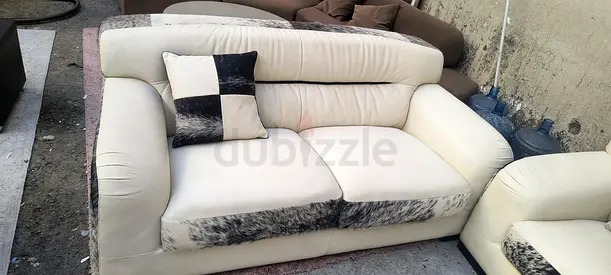 Cream leather 2-seater sofa with patterned accents - good condition