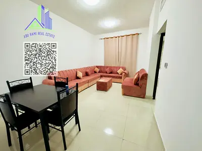 Furnished apartment for monthly rent, including bills. One bedroom, living room, two bathrooms, and a balcony in Ajman, Al Nuaimiya 1 area.