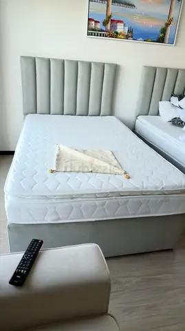 Single bed with mattress.
