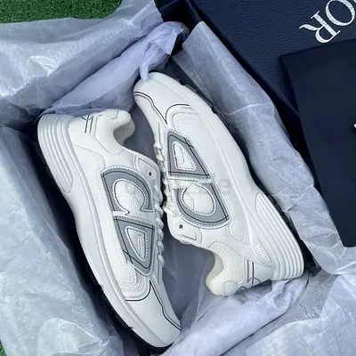 White designer sneakers (size not specified) - barely used
