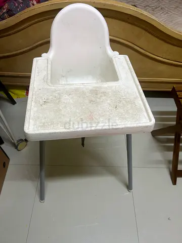 Simple white baby high chair / booster seat with metal legs