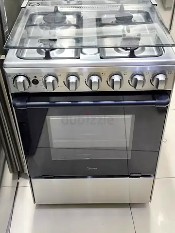 Midea gas cooker 4 burner like new condition price 900