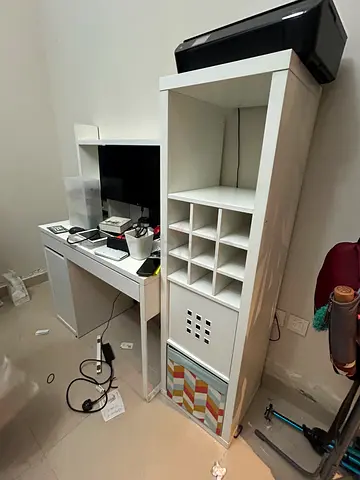 White modular shelving unit with desk and cubby storage - used