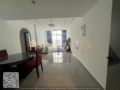 Annual rent 2BR hall, first tenant in new tower Al Nuaimiya 3 near Dubai Islamic Bank, opposite Sharjah Coop. Central AC, free parking.