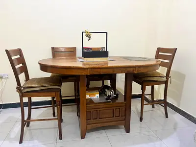 150 AED Solid Wood Oval Dining Table with 4 Matching Bar-Height Chairs - Good Condition