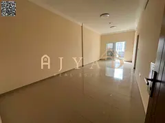 First-tenant 2BR hall for annual rent in Al Jurf 3, Ajman. 2 bedrooms, 3 baths, central AC, balcony,