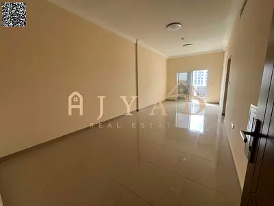 First-tenant 2BR hall for annual rent in Al Jurf 3, Ajman. 2 bedrooms, 3 baths, central AC, balcony, wardrobes, easy payments, easy Dubai exit.