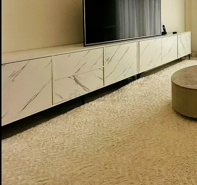 Long modern TV cabinet with marble-effect doors