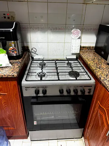 Used freestanding 4-burner gas stove with oven and gas cylinder 20kg good working condition
