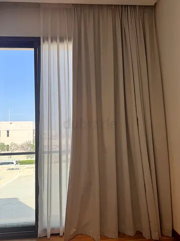 Black out and sheer curtains with rails
