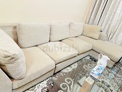 Light beige L-shaped fabric sofa with chaise - good condition