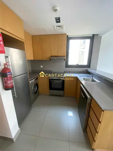 One bedroom with two bathrooms and appliances