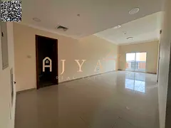 1BR hall for annual rent in Al Jurf 3. Master bedroom, 2 baths, central AC, balcony, wardrobes, easy