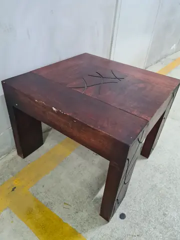 Solid wood side table with carved design