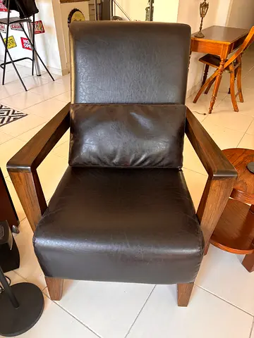 Very comfortable, Dark brown real leather lounge chair with wooden frame - good condition