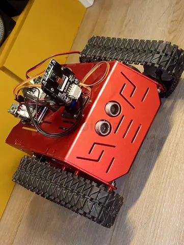 Red custom made metal body mobile wifi camera esp32 controllable and automated conquerer tank..
