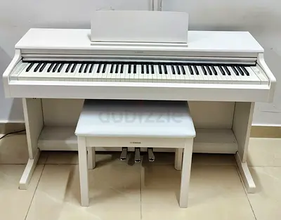 The Yamaha Arius YDP-164 WH (White Ash) is a premium, furniture-style digital piano designed for