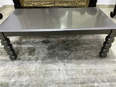 Simple grey wooden coffee table with turned legs - good condition