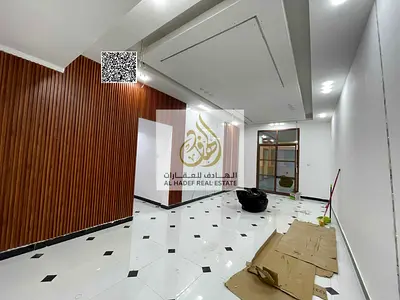 Two bedrooms and a living room in Rawda 3 Near Khartoum Street Near Dubai and Sharjah exit Super deluxe finishing Payments in 4 installments Security