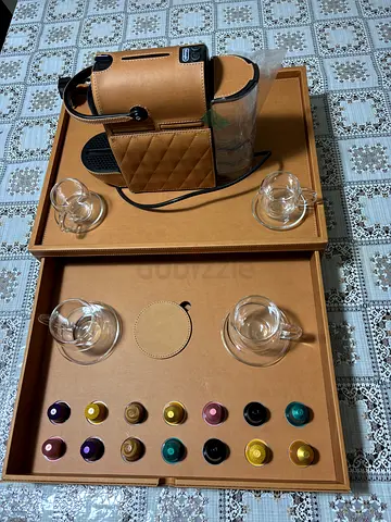 Delonghi Nespresso Inissia Coffee Machine with Assorted 14 Coffee Capsules and 4 glasses and saucers
