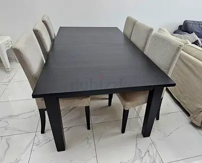 For sale due to relocation, solid brown wooden dining table with six very comfortable chairs
