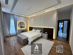 Villa for sale next to the mosque and near Sheikh Mohammed Bin Zayed Road, premium finish at an attr