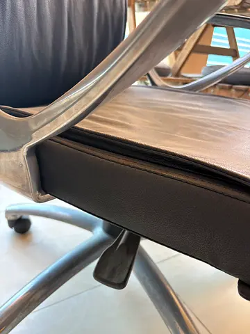 Used black leather office/desk chair with metal frame and wheels