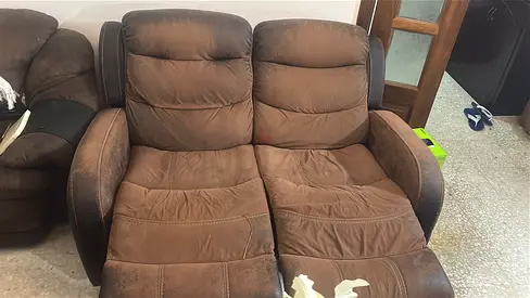 Two-seater brown reclining sofa in used condition