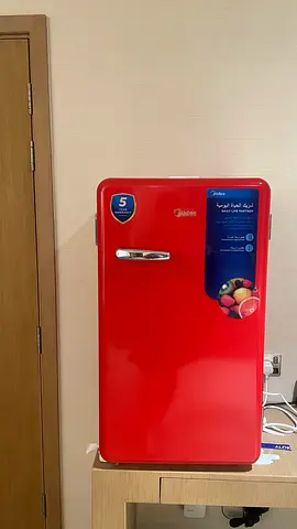 Compact red single-door mini fridge – good working condition