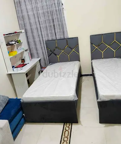 Pair of Modern Single Beds with Grey Padded Headboards