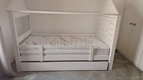 White House-Style Kids Bed with Trundle and Guard Rails - it has additional space and mattres undern