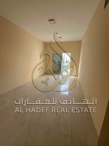 Two-bedroom apartment with a living room, two bathrooms, and a balcony for annual rent in Sharjah, Al Majaz 2 area.