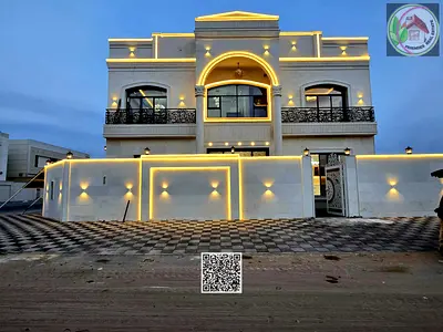 Stone villa directly opposite Al Hamidiya, central air conditioning, registration, electricity, and water included, freehold ownership, no fees.