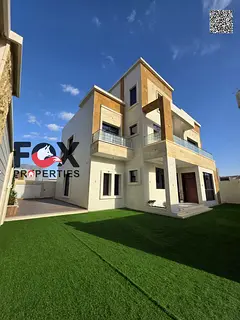 Corner villa for sale in Al Zahia, Ajman, 6 master bedrooms, large setback, registration included, e