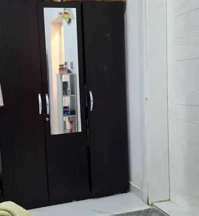 Dark Wood Three Door Wardrobe with Mirror