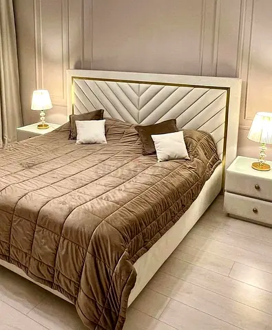 Modern upholstered queen bed with headboard and matching nightstands