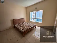 2BR apt Ajman yearly, spacious, gym+pool, large living room, balcony open view, modern finishes, ele