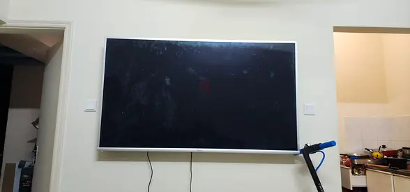 Wall Mounted Flat Screen TV with Silver Frame