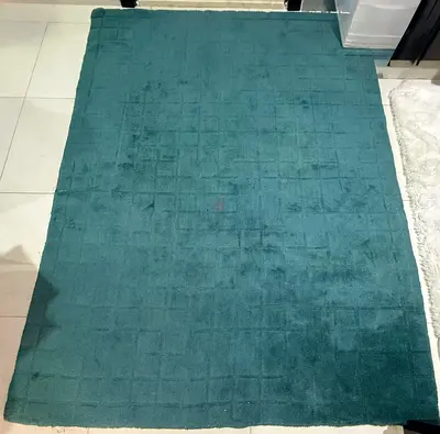 Teal solid color area rug - good used condition