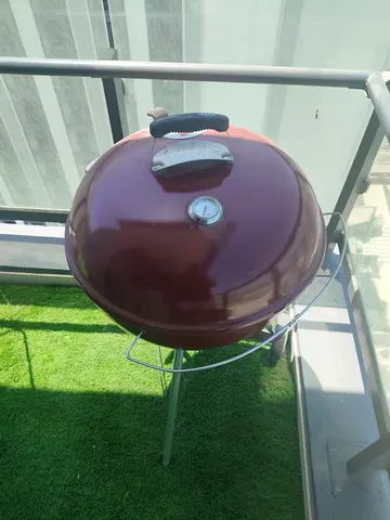 Used round charcoal BBQ grill with lid and thermometer