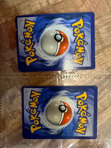 Two Pokémon Trading Cards (backs shown) - Good for collection or play
