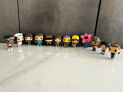 Collection of 12 Stranger Things Funko Pop figures - mixed characters