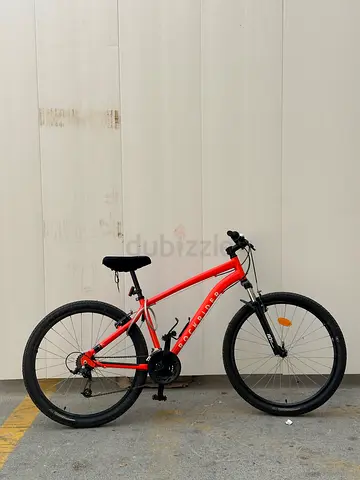 Used BTWIN Rockrider orange mountain bike - 27.5 wheels, good condition excellent brakes and gears