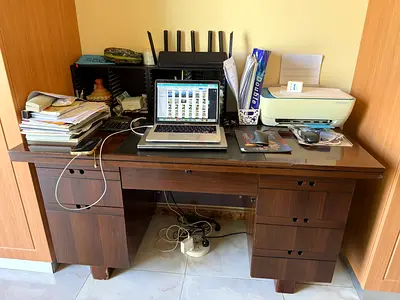 Solid wood office desk with storage drawers and desk chair