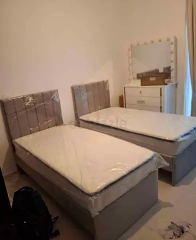 Two Single Bed Sets with Fabric Headboards and Mattresses