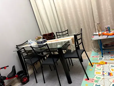 Glass Top Dining Table with 6 Black Metal Chairs