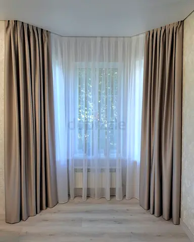 Full-length beige blackout curtains with white sheer - set for bay window