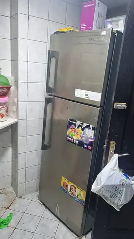 Used double-door stainless steel refrigerator - good working condition